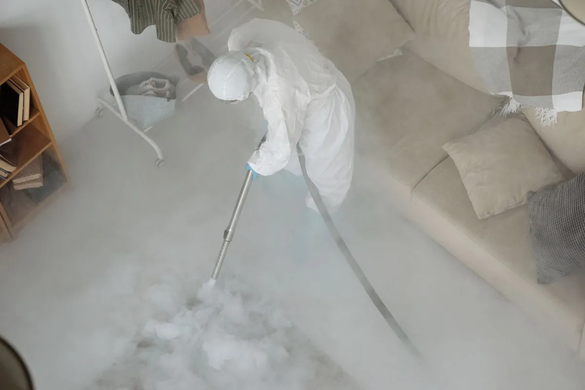 Biohazard cleanup technician in protective equipment, Orleans, MA